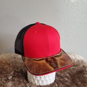 Ball cap with hand-sewn leather patch on brim.